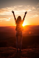 Fototapeta premium b'girl standing on a mountaintop with her arms in the air'