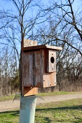 A close view of the old wood birdhouse.