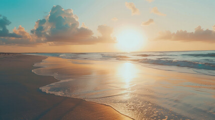 A tranquil scene of a sun rising over calm ocean waters, reflecting on the wet beach sand