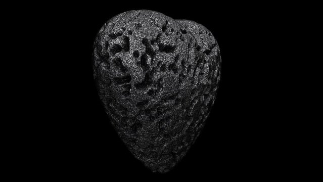 Realistic DOF camera looping 3D animation of the spinning weathered and aged dark stone or granite heart rendered in UHD with alpha matte