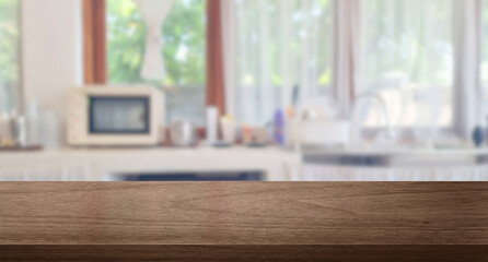 brown wooden table top on blur cafe minimal kitchen counter at background in bright color mood and...
