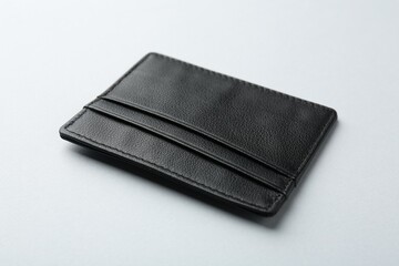 Empty leather card holder on light grey background