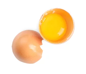 Rolgordijnen Cracked chicken egg with yolk isolated on white, top view © New Africa