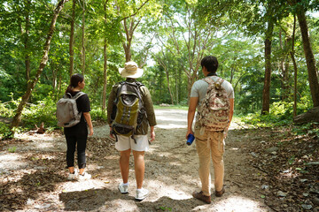 Group of three Asian friends, two men and one woman, have a good relationship, hiking , nature...
