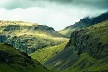 Dramatic Icelandic mountain with sunlight shining in summer