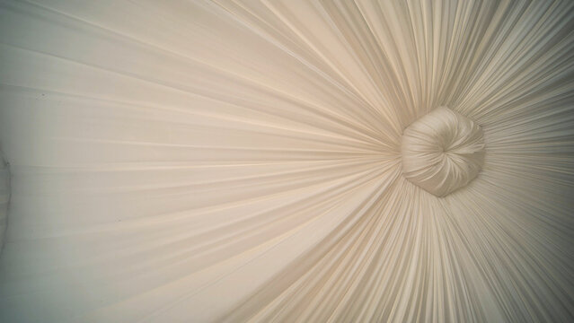 Ceiling of a wedding tent at a wedding celebration. - Powered by Adobe