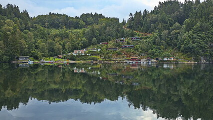 Fototapeta na wymiar Residential houses at the bay Osevagen in Norway, Europe 