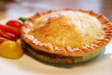 Plate of Delectable Freshly Baked Golden Brown Meat Pie