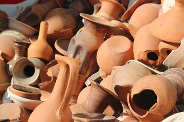 stacked together broken clay pots