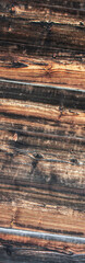 Fragment of the cladding of an old house made of boards. Diagonal pattern on old boards. Diagonal...