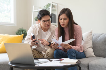 Stressed financial owe asian young couple love sitting suffer, stressed and confused by calculate...