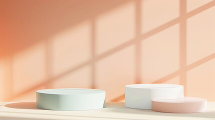 Three cylindrical plinths pastel peach, white and blue light color for products on light peach background. Sunlight, tender window shadows. Copy space.