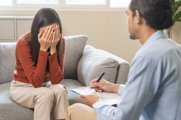 Psychology, depression. Suffer asian young woman consultation with psychologist while patient...