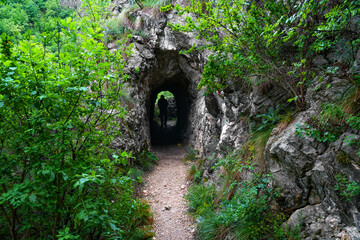 Stone carved tunnel in Nerei Gorges Natural Park, Romania, Europe	