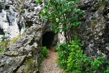 Stone carved tunnel in Nerei Gorges Natural Park, Romania, Europe	