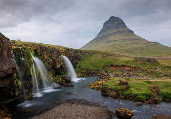 Kirkjufell, a church mountain, is the most photographed mountain in Iceland, with a unique shape...