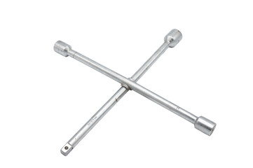 Detail of a typical and classic cross-shaped socket wrench for car wheel screws and bolts on a...