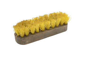 Detail of a classic wooden manual brush with plastic bristles for cleaning. It is an old used brush...