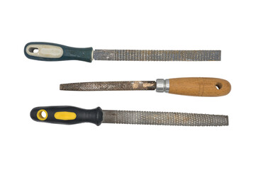 Detail of some scrapes to reduce wood on a white background. There are flat and half-round rasps. Wooden handle and plastic handle