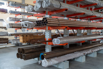 Warehouse cantilever racks for storing copper pipes or profiles. Pallet racks and industrial...