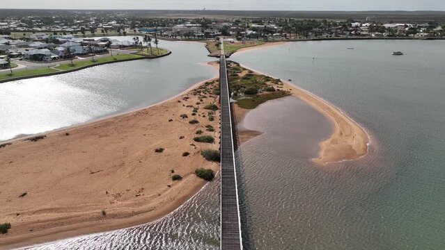Aerial of the long pedestrian bridge at the ocean, Carnarvon, Western Australia, Australia, Pacific
