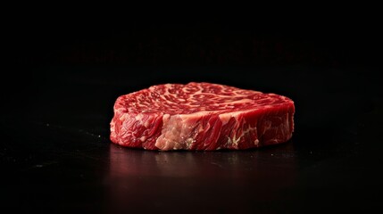 Premium raw beef steak on dark background