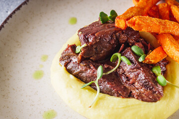 delicious stewed beef cheeks on mashed potatoes