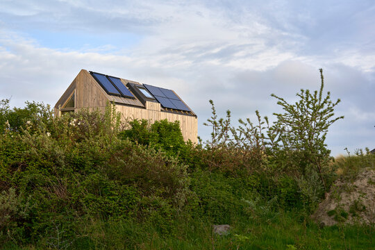 Environmentally friendly eco house with solar cells and photovoltaic. Sustainable vacation home in nature. Holland, Zeeland.