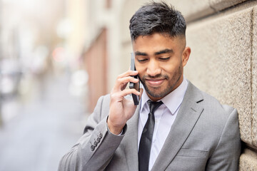 Phone call, business man and wall in city for talking, conversation and salesman listening to contact for news. Mobile, Indian professional and discussion outdoor for deal, negotiation or network