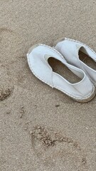 beach shoes on the ocean
