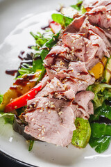 warm salad with roast beef, eggplant, zucchini, mushrooms and pesto sauce