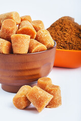 Organic Gur or Jaggery Powder and cubes, Jaggery is used as an ingredient in sweet and savoury dishes in the cuisines of India.