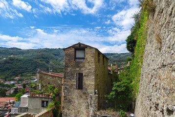 Walking along the streets in the town center of remote hinterland village Dolceaqua, Province of...
