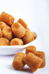 Organic Gur or Jaggery Powder and cubes, Jaggery is used as an ingredient in sweet and savoury dishes in the cuisines of India.