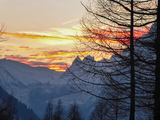 Beautiful sunset view of snow capped Mont Blanc mountain range massif in Alps seen from remote...
