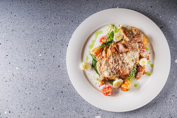 delicious fresh caesar salad with chicken cherry tomatoes and quail eggs