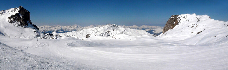 Panoramic view of the ski slopes of the famous La Plagne-Bellecote ski resort in the heart of the...