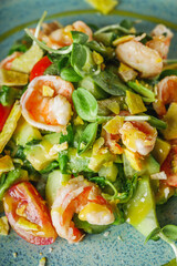 delicious fresh salad with shrimp and avocado on a beautiful plate