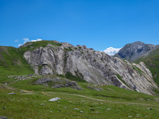 Scenic view from Monte Oserot near rifugio della Gardetta on Italy French border in Maira valley in Cottian Alps, Piedmont, Italy, Europe. Hiking on alpine pasture on sunny summer day in mountains