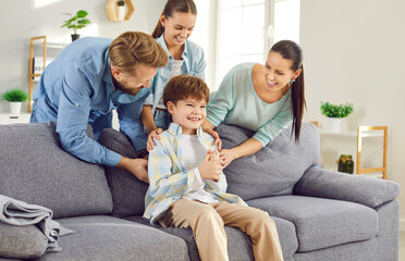 Young son, laughing boy kid with happy family portrait, loving home and happy emotion. Parents,...