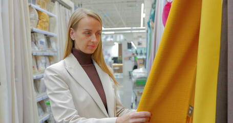 Woman designer choosing textiles for her home