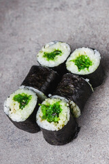 delicious fresh maki sushi roll with chuka salad