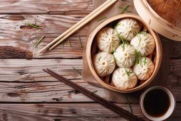 A wooden bowl filled with dumplings next to chopsticks. Perfect for food and Asian cuisine concepts