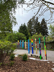 An image of multicolored columns in a kindergarten on the playground.