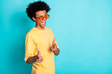 Portrait of funky cool man with afro hairstyle wear oversize t-shirt indicating at you eye blink...