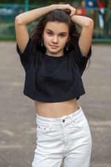 Young beautiful brunette girl, autumn park outdoors - obrazy, fototapety, plakaty