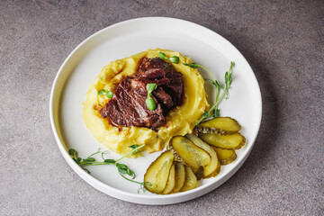 delicious stewed beef cheeks on mashed potatoes