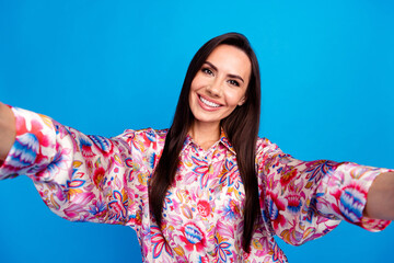 Photo of excited good mood lady dressed print blouse smiling tacking selfie isolated blue color background - obrazy, fototapety, plakaty