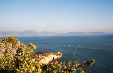 Gulf of Naples with the bay Trentaremi below seen from the Virgil Park at sunset. Italy.