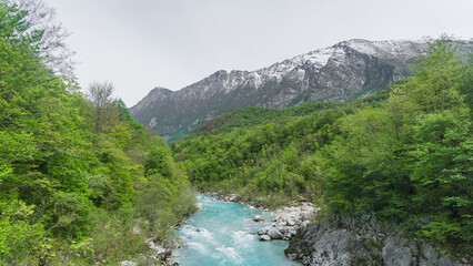 Soča or Isonzo turquoise river valley on a cloudy day